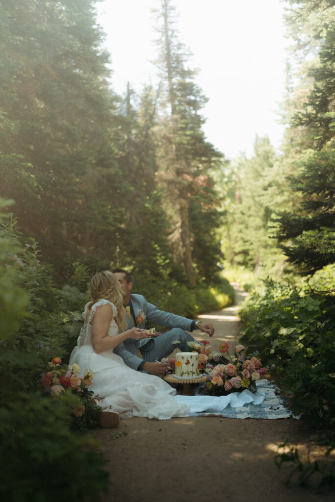 Glacier National Park Wedding, Niki Day Creative a private moment for the couple sharing their cake