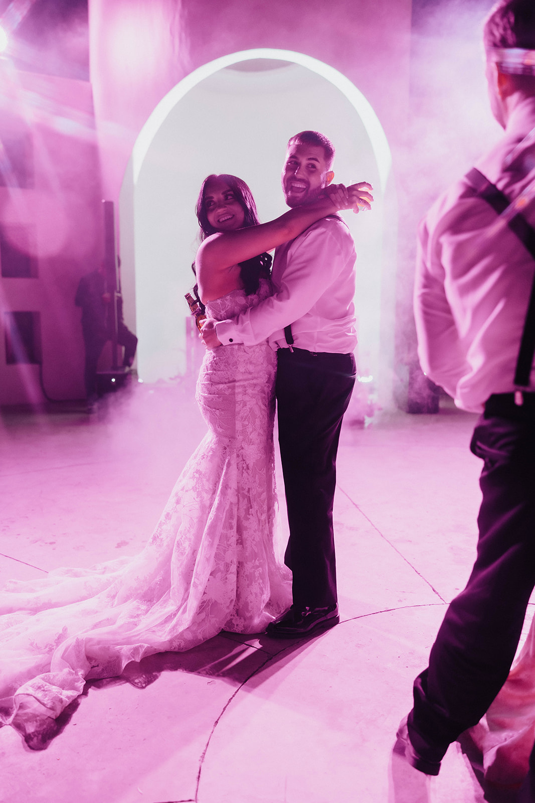 A couple sharing a dance at a wedding reception.