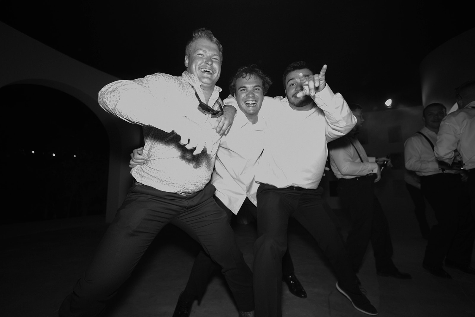 Group of people enjoying a dance party at a wedding