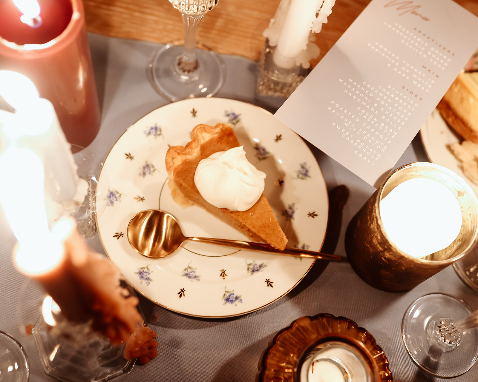 Family enjoys thanksgiving dinner together at the thanksgiving dinner table designed and styled by Ember and stone events