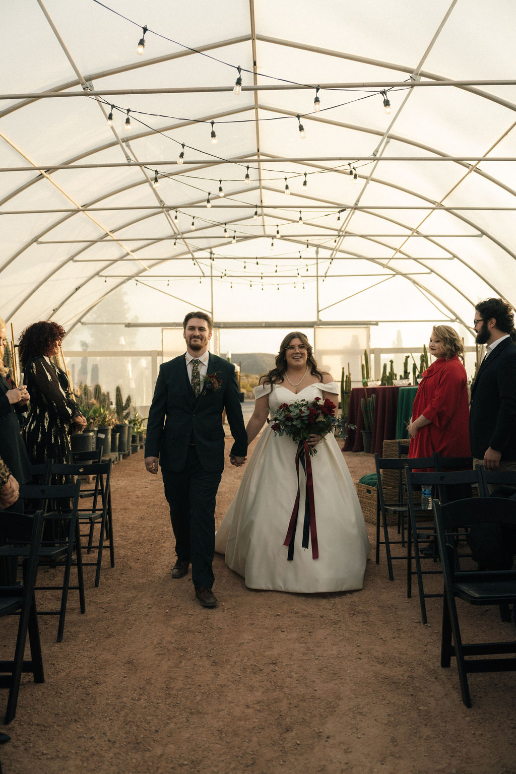 Bride and Groom walking down the aisle at Cactus Joe's Nursery 