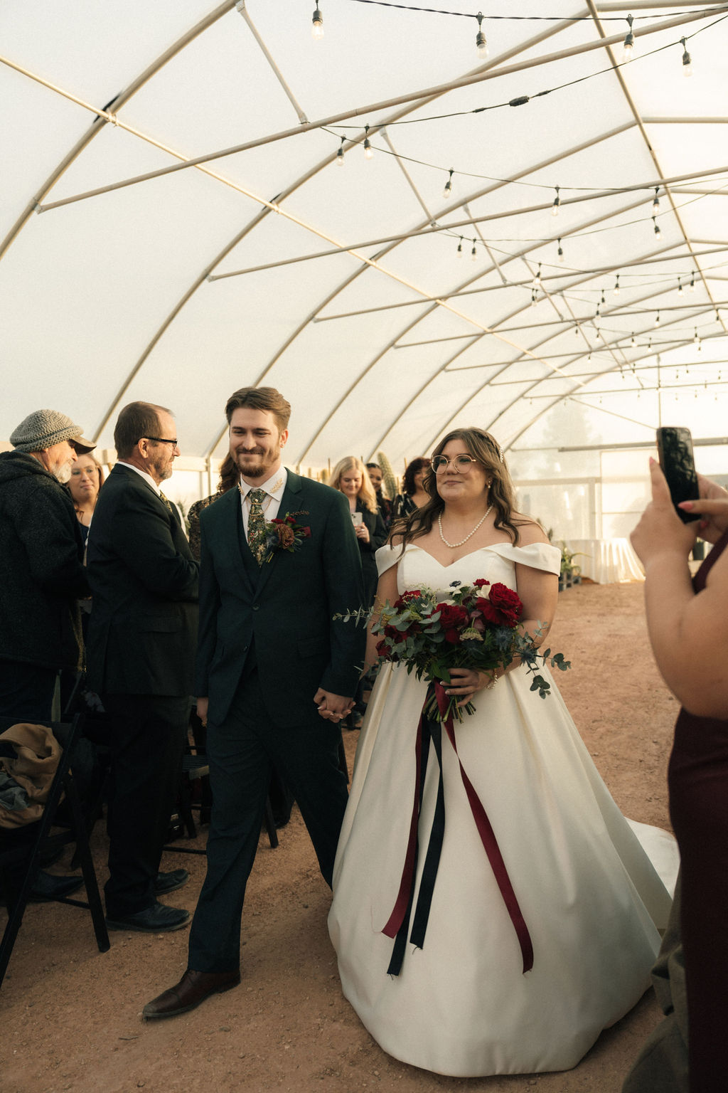 Bride and Groom walking down the aisle at Cactus Joe's Nursery 