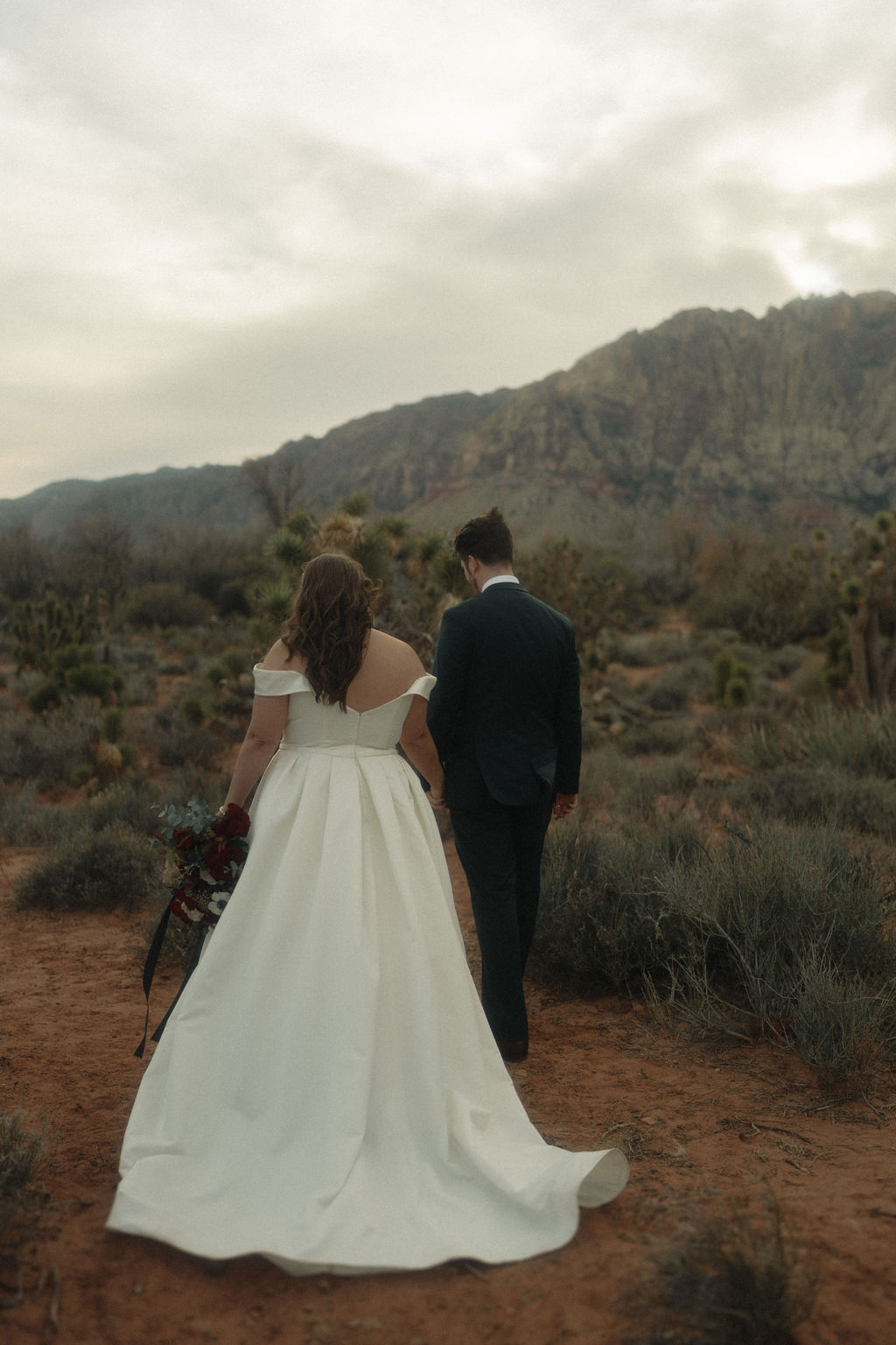 Couple posing on their wedding day at Cactus Joe's Nursery