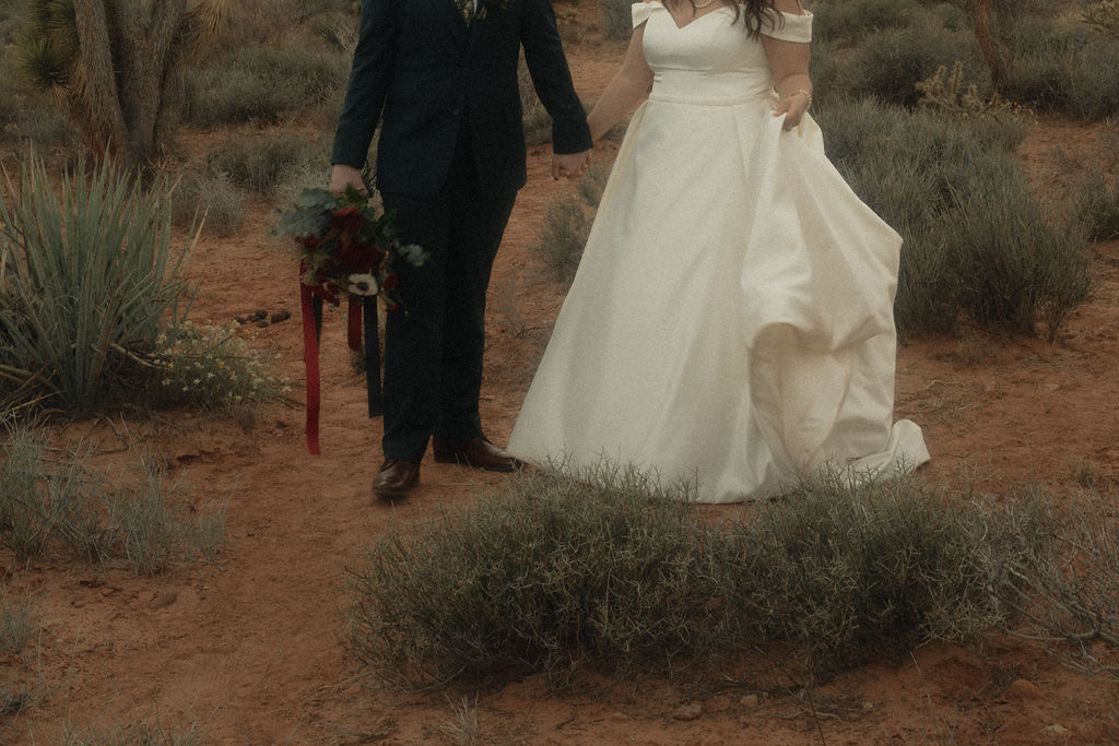 Couple posing on their wedding day at Cactus Joe's Nursery