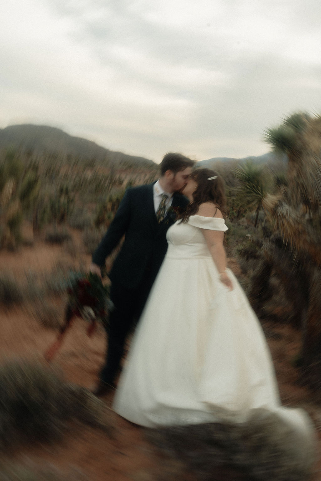 Couple posing on their wedding day at Cactus Joe's Nursery