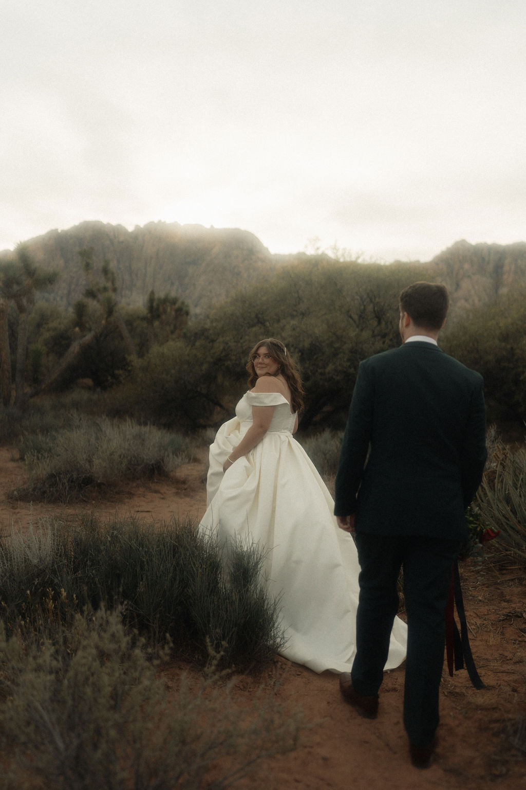 Couple posing on their wedding day at Cactus Joe's Nursery 