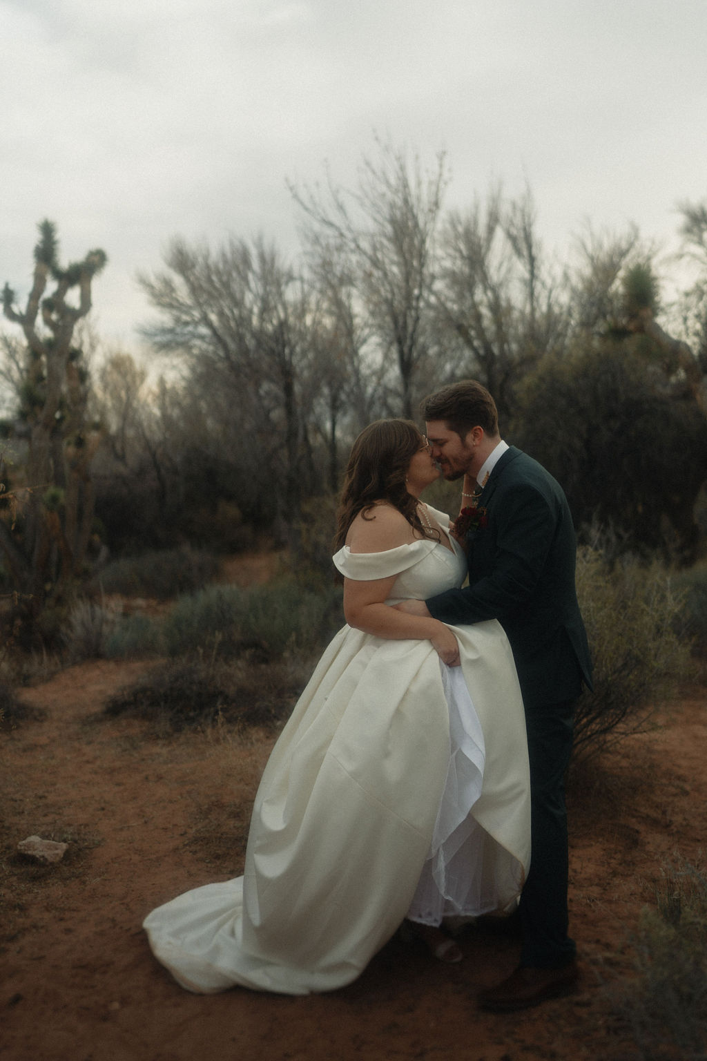 Couple posing on their wedding day at Cactus Joe's Nursery 