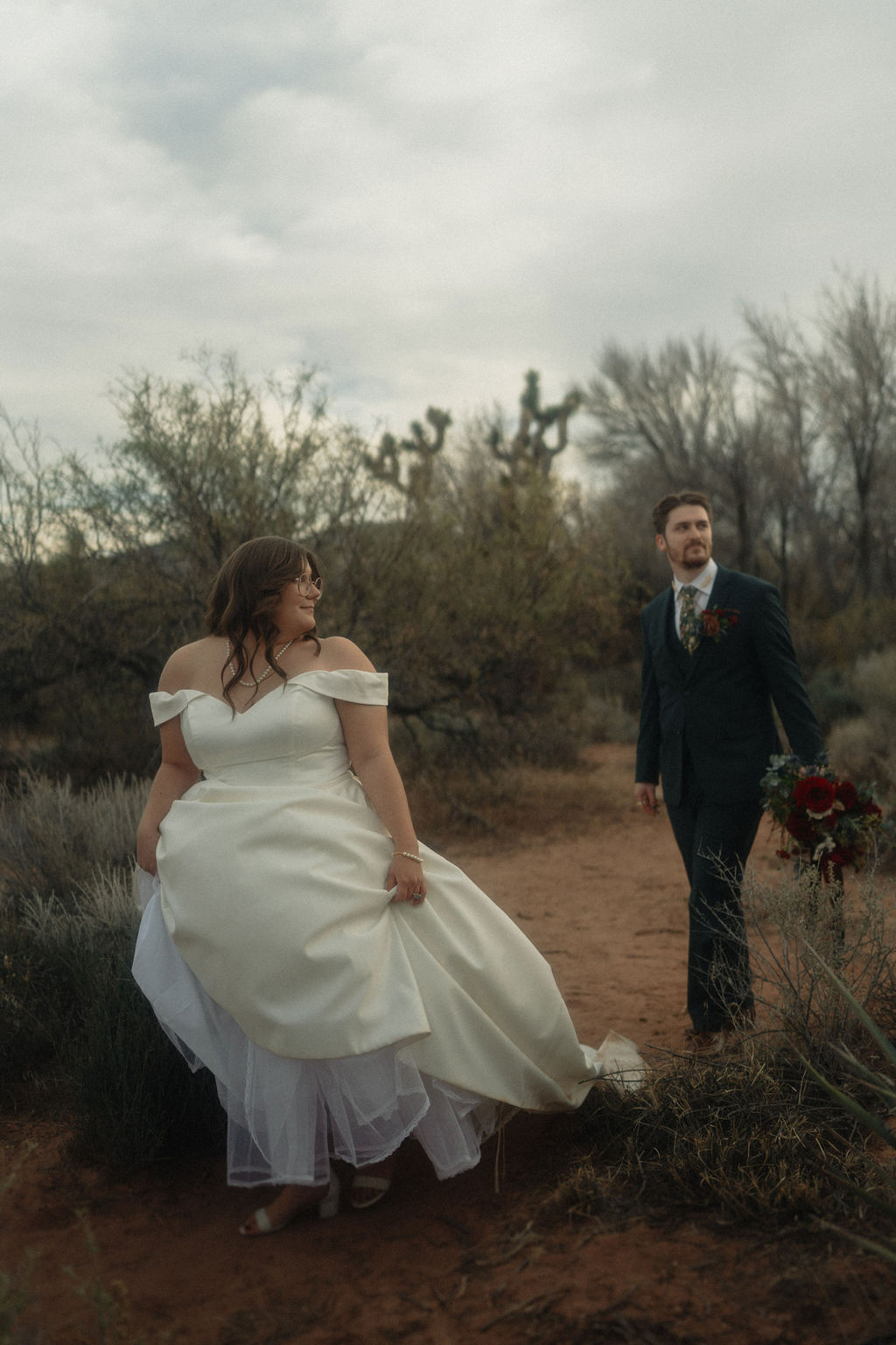 Couple posing on their wedding day at Cactus Joe's Nursery 