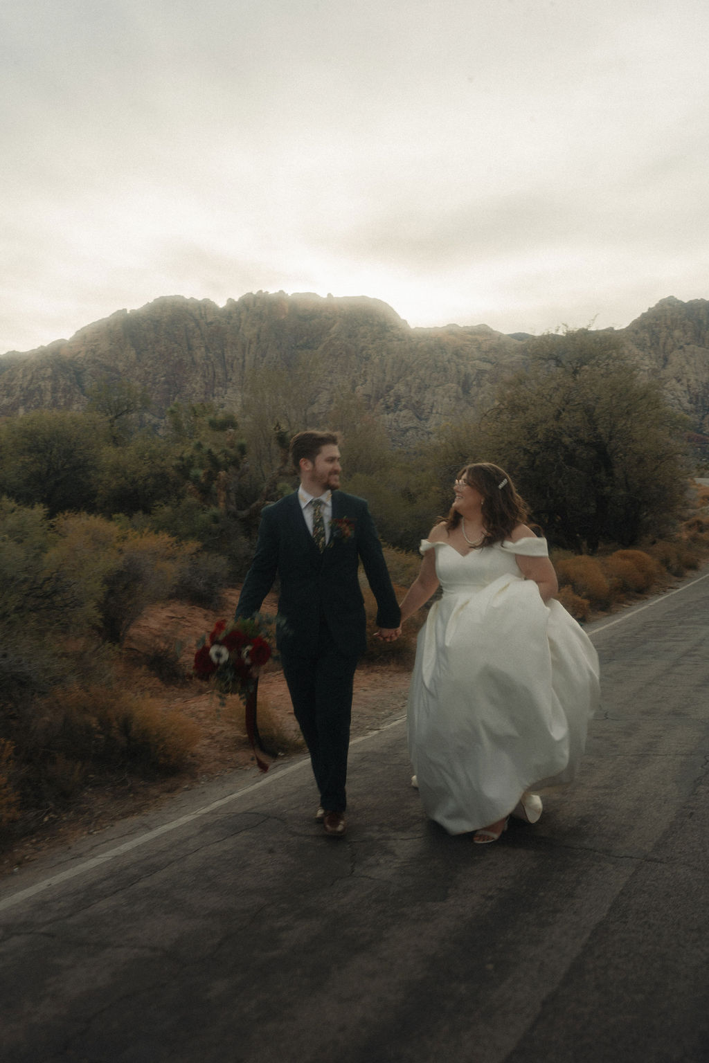 Couple posing on their wedding day at Cactus Joe's Nursery 