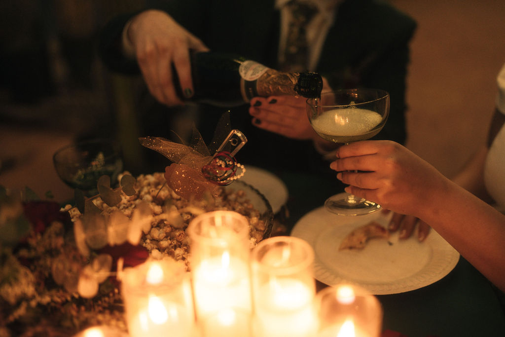 Couple enjoying their wedding and eating pizza during their reception 