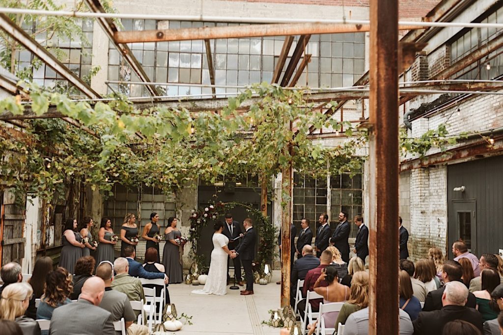 Industrial Wedding Venue, Rustic outdoor ceremony with vines hanging from above, Columbus Wedding Venue, East Coast Wedding Venue, Ohio Wedding, Ohio Wedding Planner 